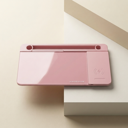 Pink cutting machine on a light beige surface